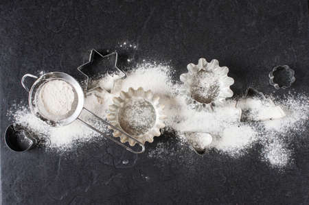 Baking cups and flour on the tableの写真素材