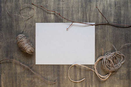Blank sheet of paper and decoration on the wooden  tableの写真素材
