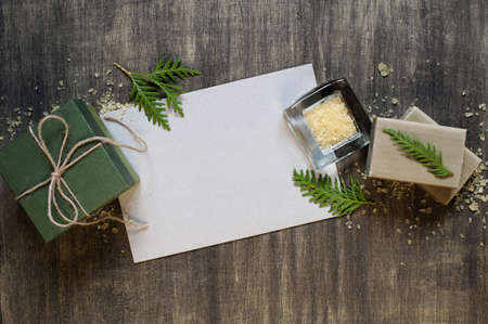 Blank sheet of paper and decoration on the distress wooden tableの写真素材