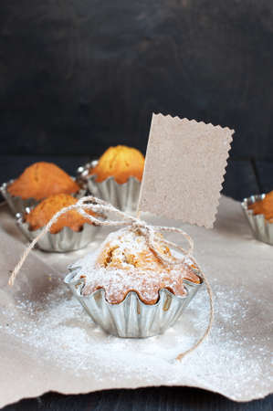 Cupcakes with empty tag on the wooden tableの写真素材