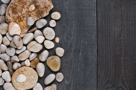 Stones on the old wooden backgroundの写真素材