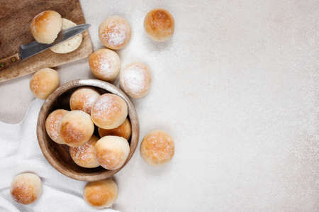 Fresh round homemade buns on the light tableの写真素材