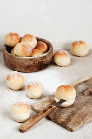 Fresh round homemade buns on the light tableの写真素材