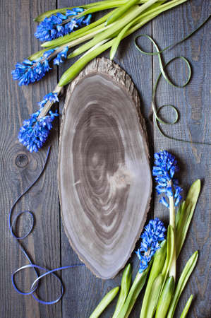 Wooden background with blue hyacinthの写真素材