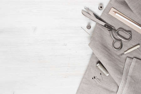 Linen fabric and sewing tools on the whiteの写真素材