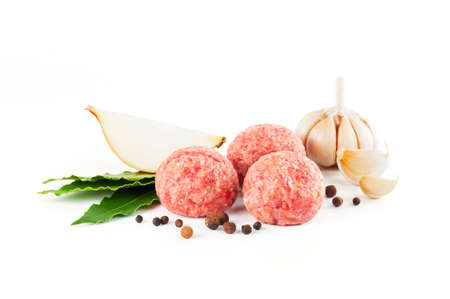 Composition with raw meatballs on the white backgroundの写真素材