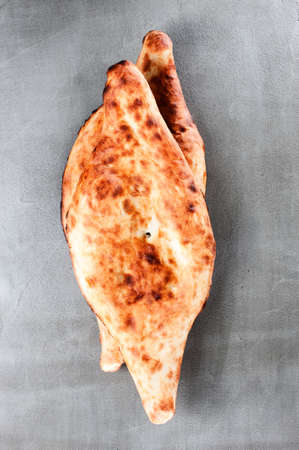 Traditional Georgian flatbread shoti on the gray table, top viewの写真素材