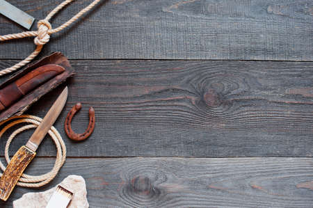 Vintage accessories for long trip on the rough wooden table, copy spaceの写真素材