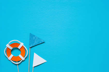 Blue background with handmade paper elements of marine decoration, copy space 
の写真素材