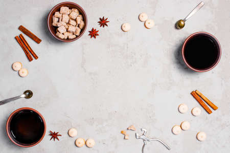 Background with spicy tea and pastry on the gray textured table, copy spaceの写真素材