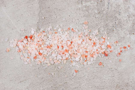 Pink Himalayan salt on the gray textured tableの写真素材