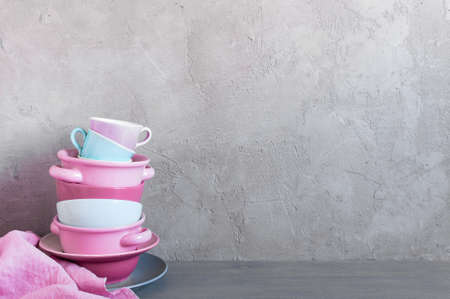 Background with colorful crockery, on the grey table against textured wall, copy spaceの写真素材