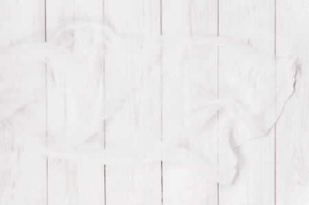 White textured wooden background with gauze, vertical boards