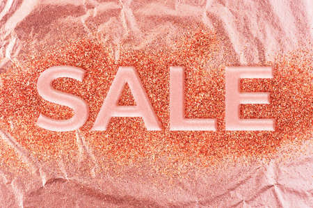 Shiny golden texture with SALE inscription , texture of pink goldの写真素材