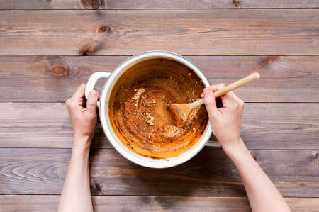 Ingredients for traditional gingerbread on the rustic wooden table, steps of preparation, top viewの写真素材