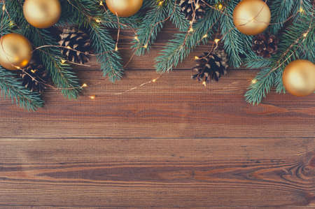 Brown wooden background with festive Christmas decoration, copy spaceの写真素材
