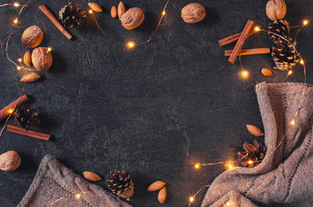 Cozy winter festive background with luminous garland, copy space