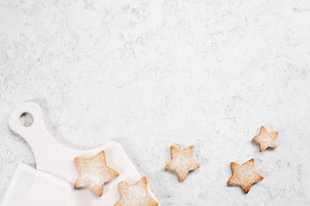White winter textured background with cookies - stars, copy spaceの写真素材