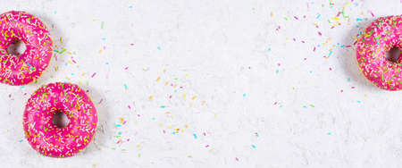 Light banner with pink donuts, copy spaceの写真素材