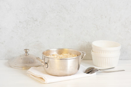Classical oatmeal porridge on the white table, healthy and nutritious breakfastの写真素材