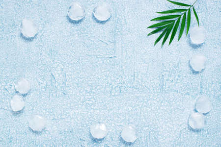 Background of ice balls on the textured blue table, copy spaceの写真素材