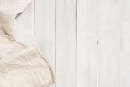 White wooden background decorated with linen napkin, copy spaceの写真素材