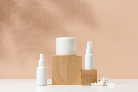 Natural background with containers for cosmetics on the wooden blocks, abstract scene with copy spaceの写真素材