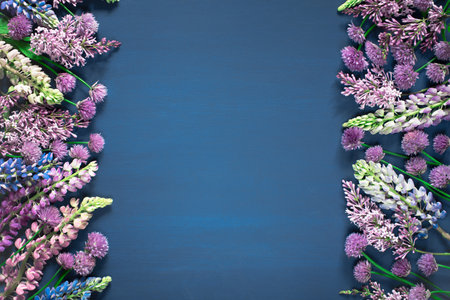 Floral blue background, frame with fresh flowers, copy spaceの写真素材