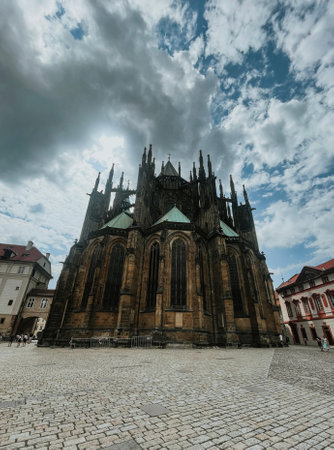 view of St. Vitus Cathedral and square nearby on a sunny day in the Czech city of Pragueの写真素材