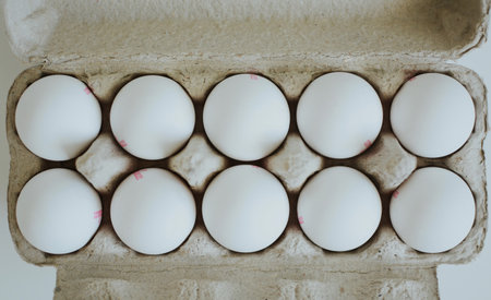 store bought box of chicken eggs lined upの写真素材