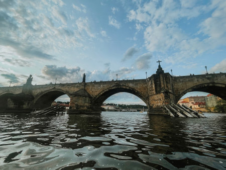 view from the catamaran to the landmark Charles Bridge in the summer Czech city of Pragueの写真素材