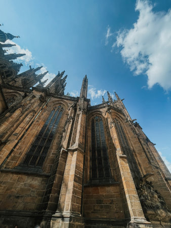 view of St. Vitus Cathedral and square nearby on a sunny day in the Czech city of Pragueの写真素材