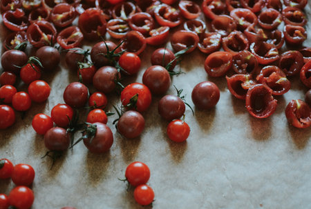 juicy red whole and cut cherry tomatoesの写真素材