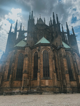 view of St. Vitus Cathedral and square nearby on a sunny day in the Czech city of Pragueの写真素材