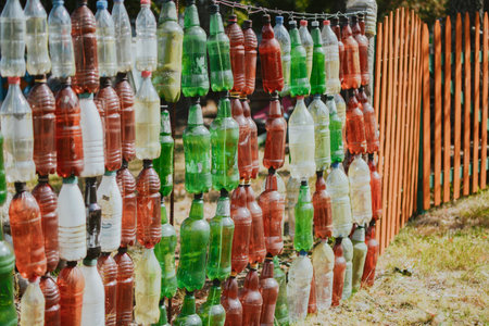 A way to reuse plastic with benefits in the form of a bottle fence while protecting the environmentの写真素材