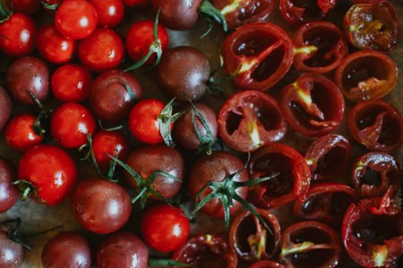 before and after: some juicy whole tomatoes and others already chopped for drying in the microwaveの写真素材