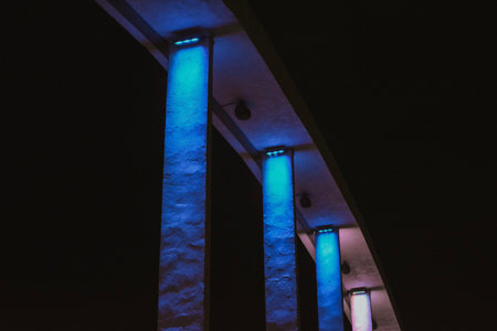 blue bridge with backlight of a European city at night in summerの写真素材