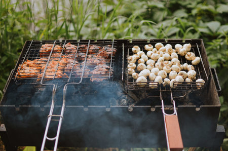 cooking juicy meat and sausages on a grill in nature on a lake in summer in Estonia