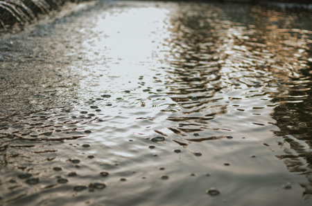 bubbles in macro photography, abstraction in a fountain with foam on a summer dayの写真素材