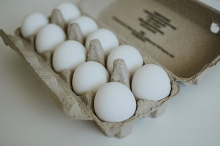 store bought eco friendly box of chicken eggs for cooking in the kitchenの写真素材