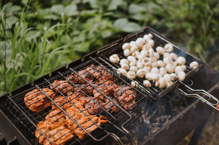 bbq meat and mushrooms on a grill in nature on a lake in summer in Estonia