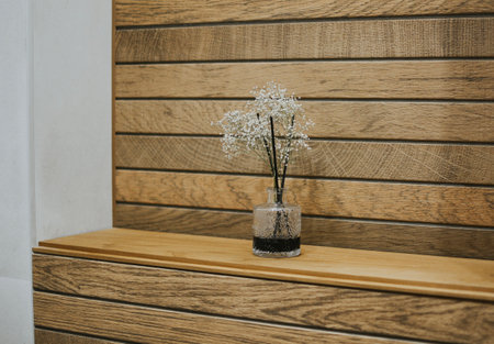 diffuser with flowers for beauty and smell on a background of wooden tilesの写真素材