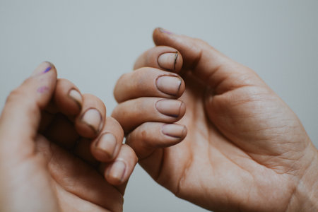 Woman's hands after gardening with dirt under her nailsの写真素材