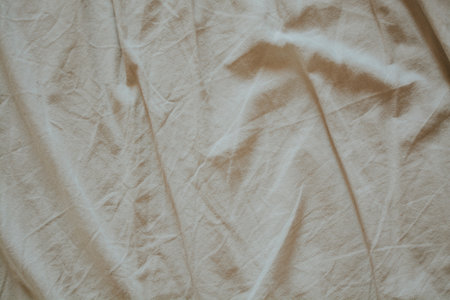 crumpled beige cotton fabric for backgroundの写真素材