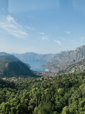 view from above to the mountains and the city of Kotor with the sea in Montenegroの写真素材