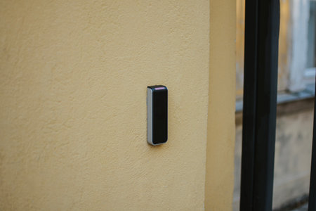 technology for key card from metal fence in the form of a lattice with a door on a lock for entry