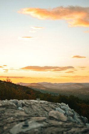 View from the top of the mountain with stones on the Adriatic sea at a beautiful bright sunsetの写真素材
