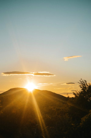 View from the top of the mountain with forest on the Adriatic sea at a beautiful bright sunsetの写真素材