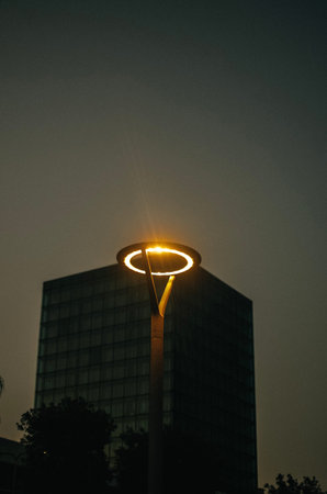 modern lantern against glass new high-rise building at sunset on promenade of Split city