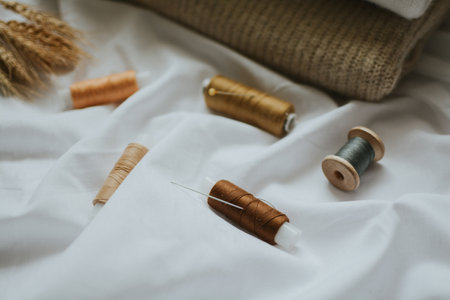 a lot of balls of thread close-up for sewing with needle for handicrafts and knittingの写真素材
